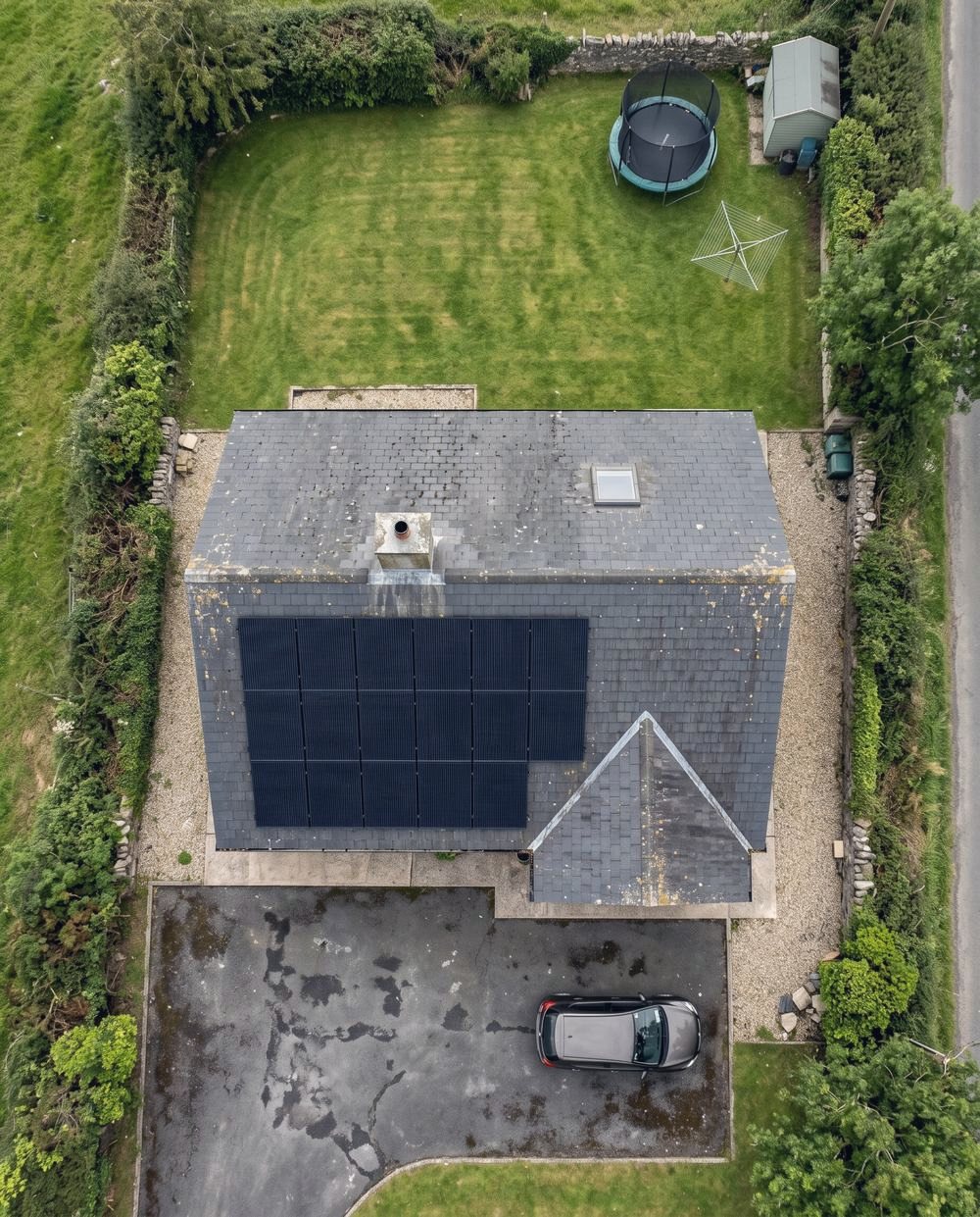 A roof of black solar panels seen from above